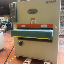 Wide belt  sander. Grizzly two head 67" X 60" belts.  Single 15 HP.  220-volt motor. Can be seen running.  New cost $20,250.    Asking $7,500.00